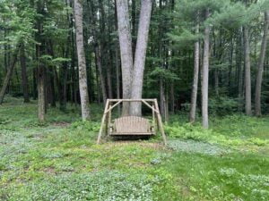 outside in the yard wooded swing